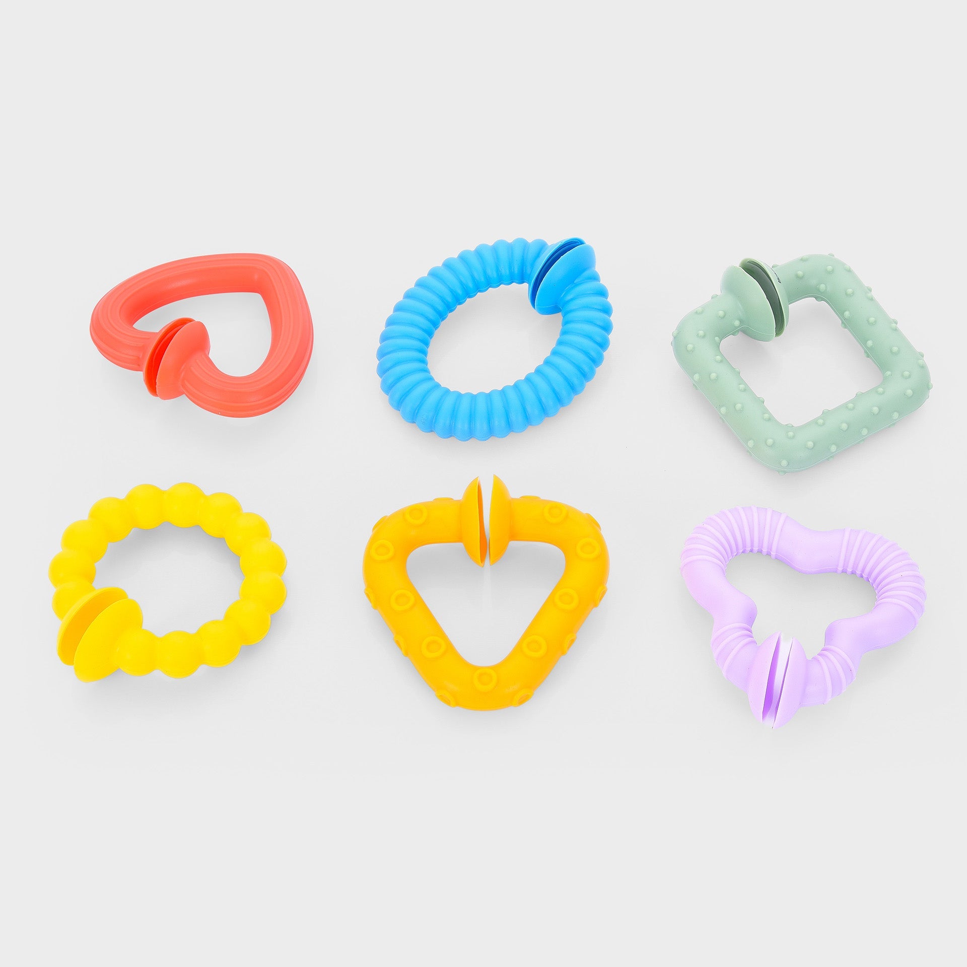 Colorful baby teething rings with varied textures and shapes for soothing gums