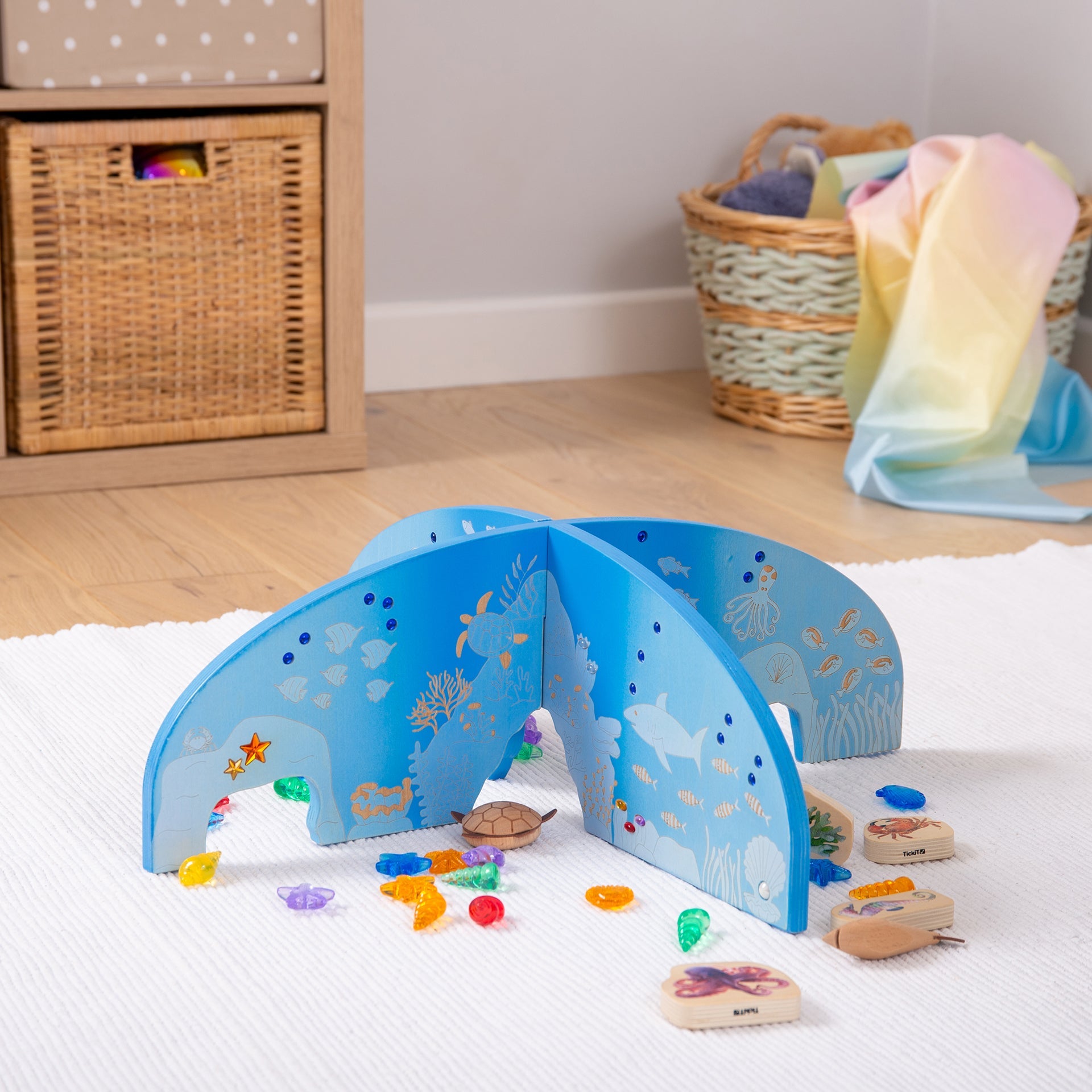 Blue wooden ocean-themed playset with sea creatures, colorful gems, and wooden animal tiles for kids' imaginative play